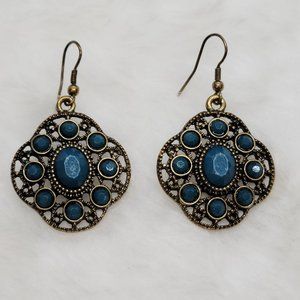 gold toned pendant earring with blue stones